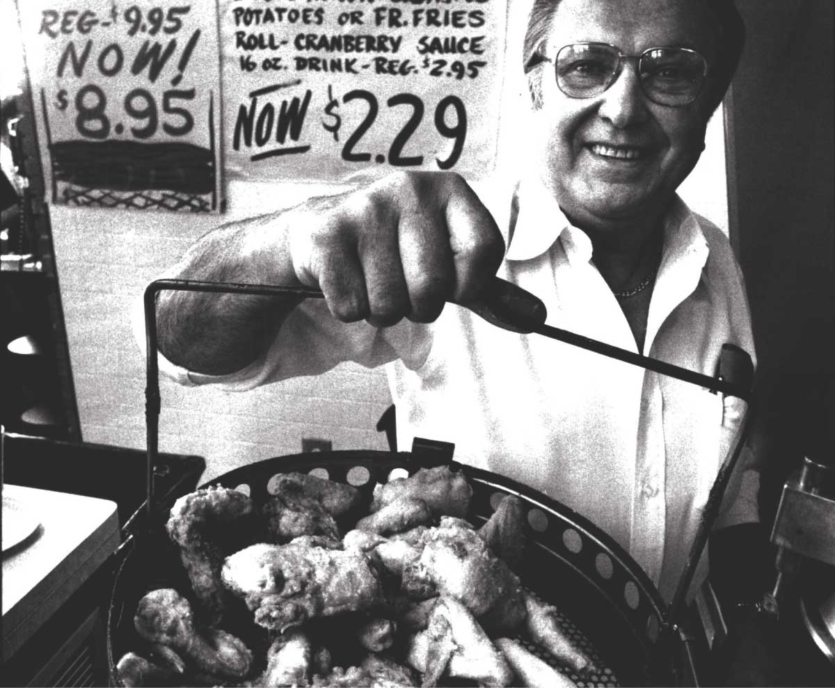 John Sobeck, founder of Chicken Shack, showcasing his original fried chicken recipe that started it all in 1956.